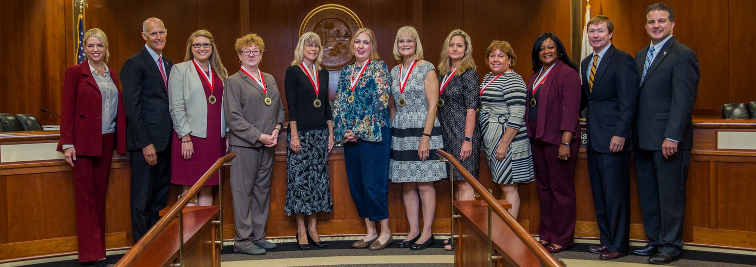 Members of the Florida Cabinet standing with eight teachers who were presented with the Governor's Shine Award.